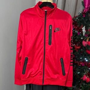 Nike Men’s Jacket Sz L  Full Zip Closure 2 zippered pockets. Red Color
